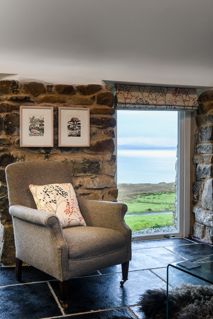 Blackhouse luxury self-catering cottage. Think Harris tweed furnishings, local sheepskins and and sheepskins.