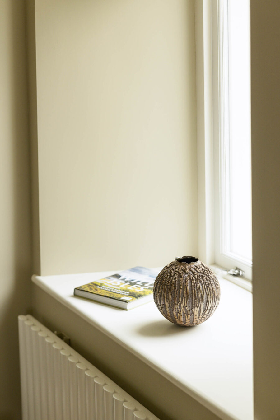 Rounded ceramic flask in encrusted brown glaze by Skye artist Patricia Shone.