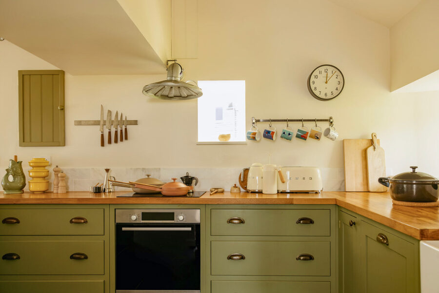 Cooker with induction hob in the hand made deVol kitchen at Mint Croft, Skye.